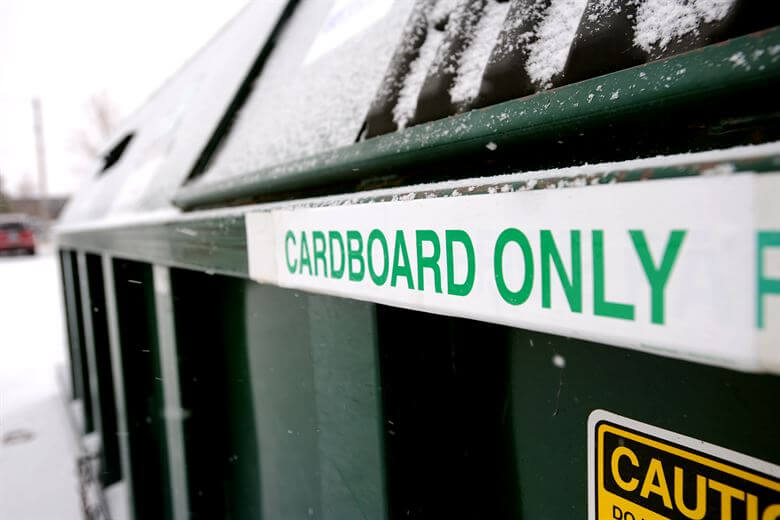 Dumpster with the words Cardboard Only on the side